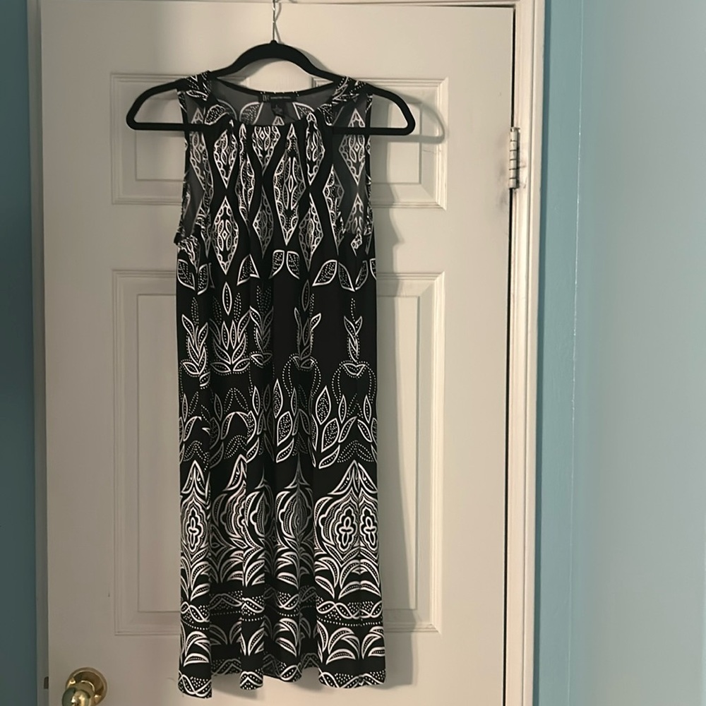 Light weight INC dress, some stretch. Very comfortable.
